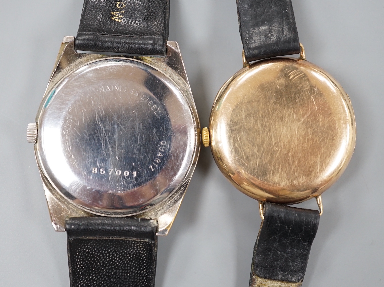 A gentleman's 1930' 9ct gold manual wind wrist watch, on a leather strap, 27.5 grams and a similar stainless steel Watches of Switzerland Seafarer Quartztronic watch.